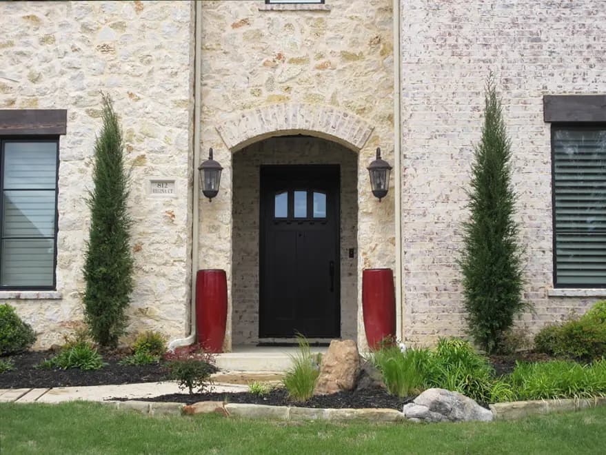 Eastern Red Cedar ‘Taylor’ Aka Taylor Junipers, planted to flank and enhance an entrance.
